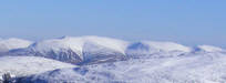 Distant view of a snowy Helvellyn 